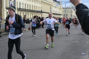 Justin takes it in his stride during the 2013 Brighton marathon (c) EIA