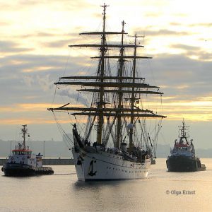Traditional Germany Navy training vessel the Gorch Fock in the water straddled by two barges