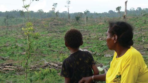 Manu Malak with his mother Maryodi, West Papua