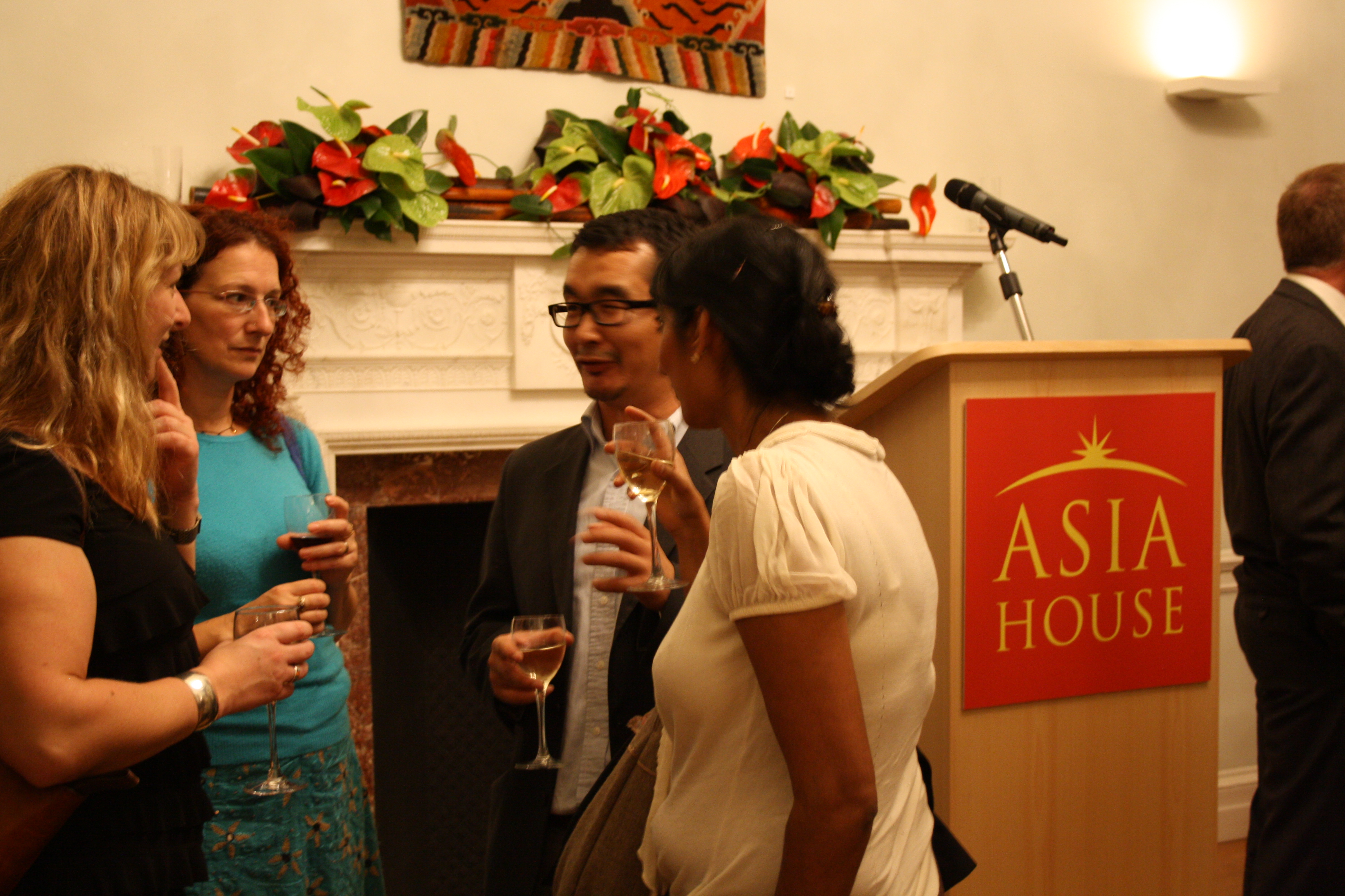Taking photos at the opening of the Asia House exhibition. Copyright EIA